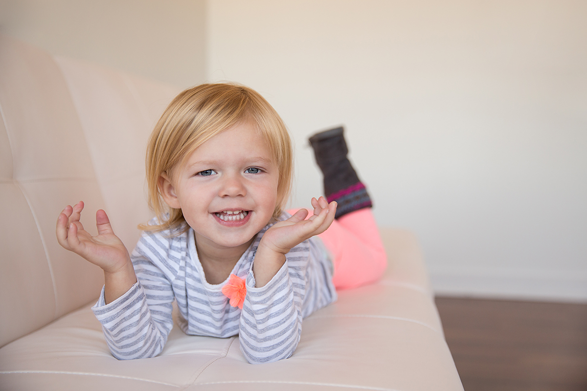 toddler having fun on the couch