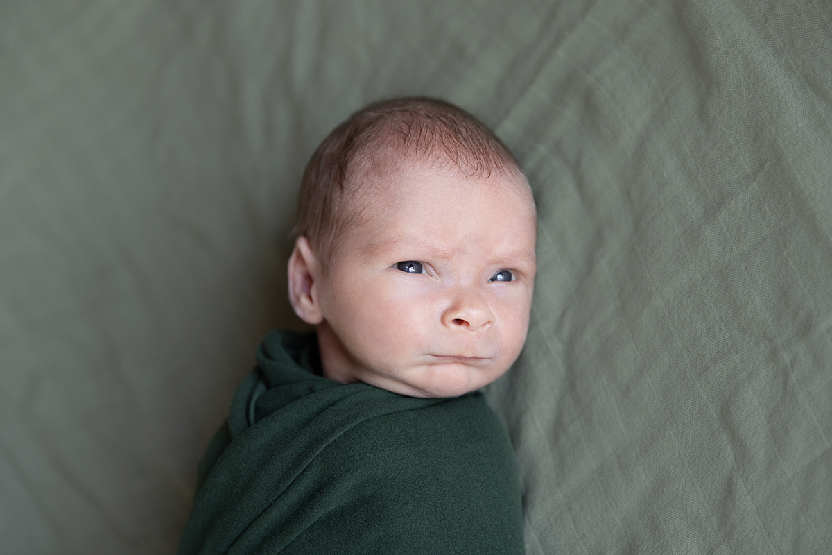 Newborn in green wrap