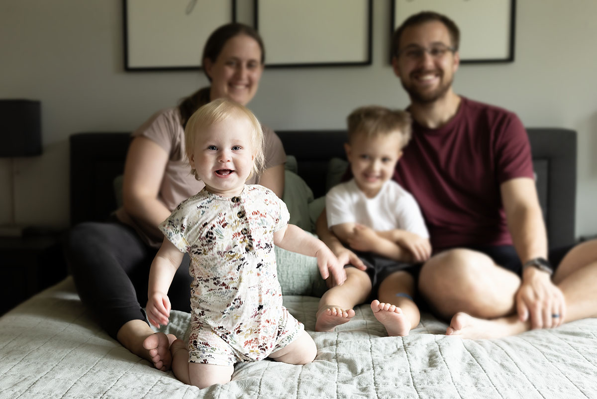 Chanhassen family snuggling in bed real family moments