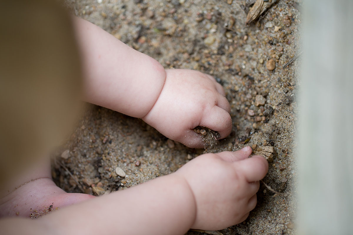 hands in the sand