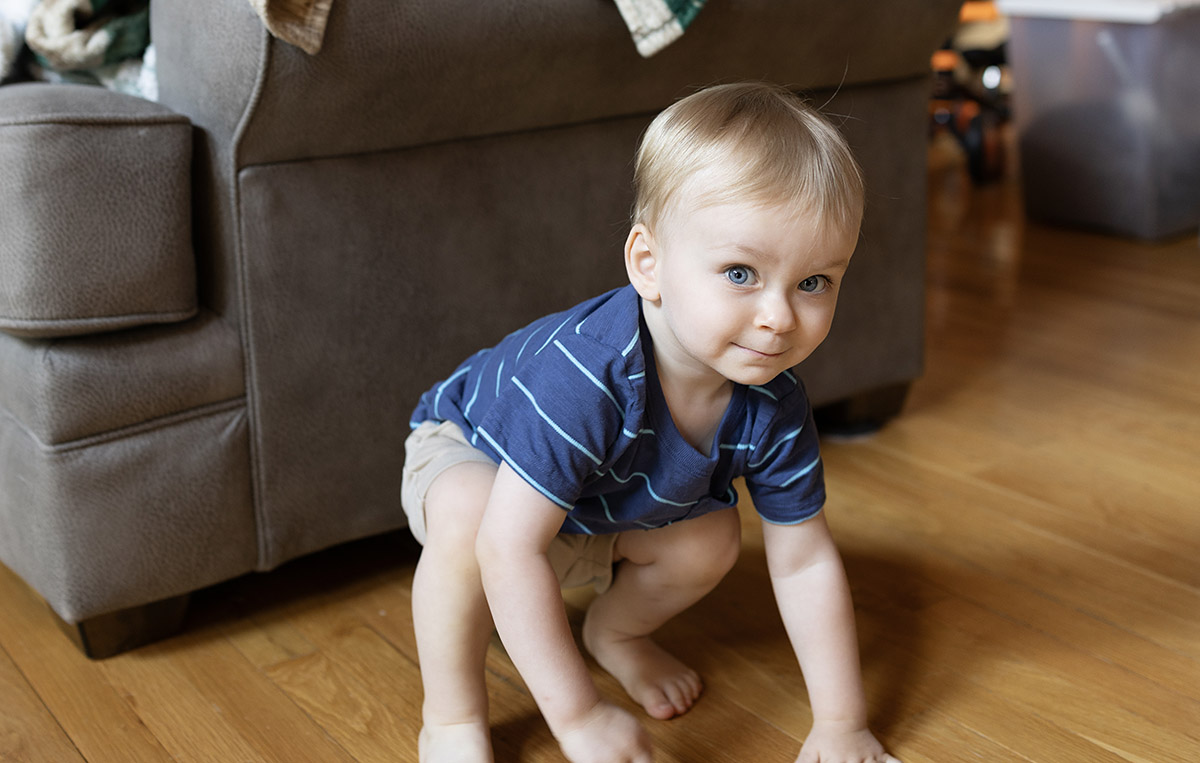 sneaky kid trying to hide from the camera