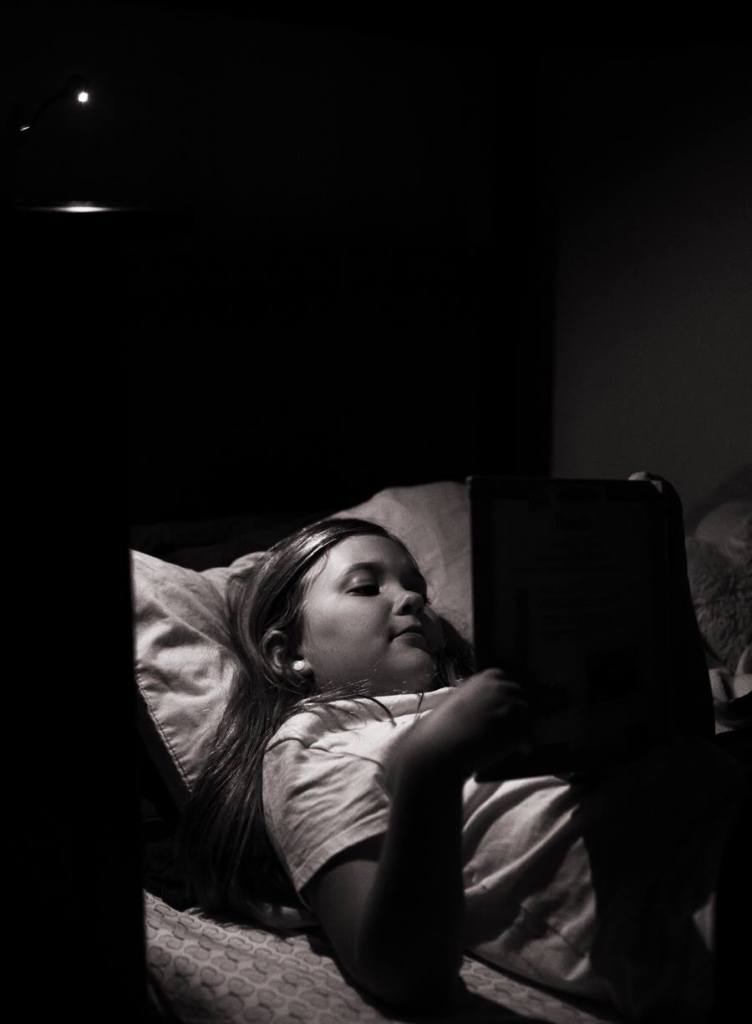 tween reading a book before bed