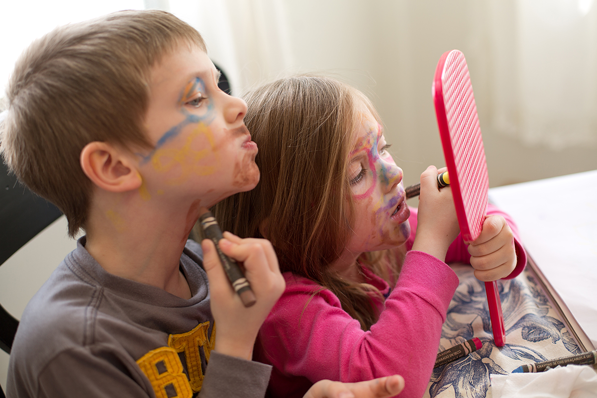 kids drawing on their faces