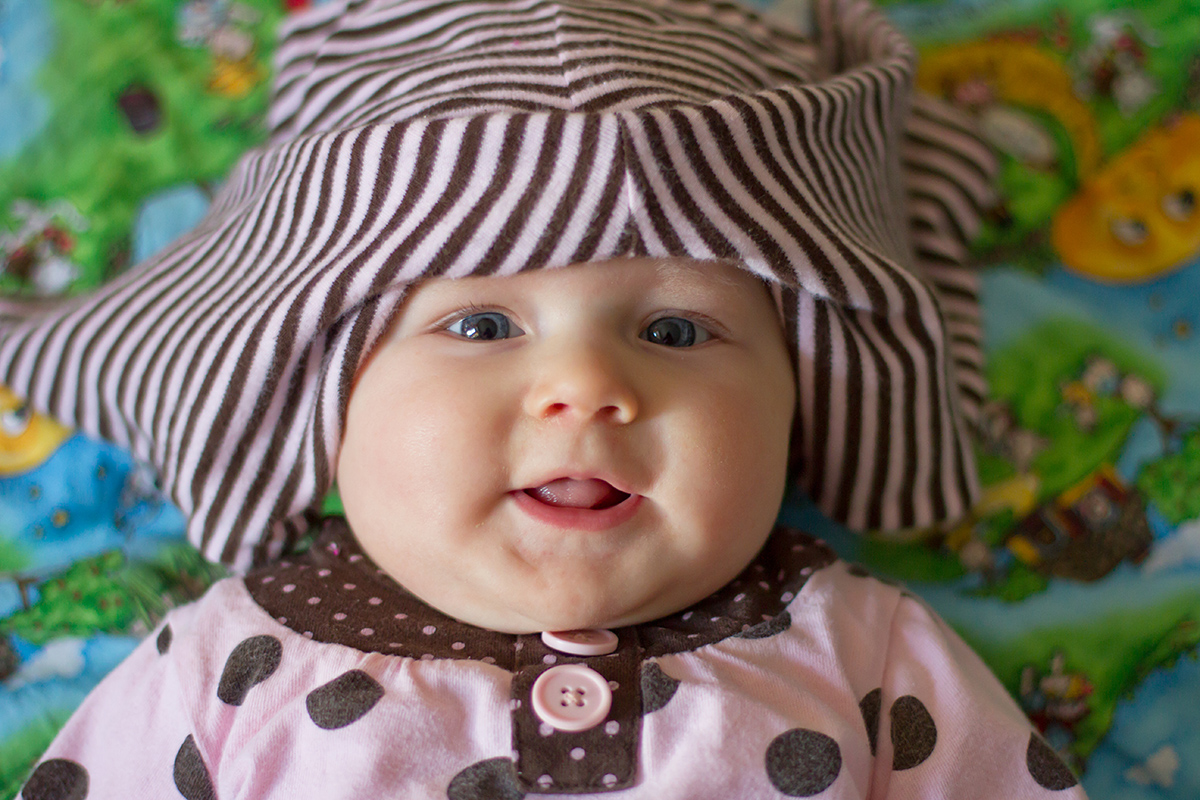 silly baby with pants on her head